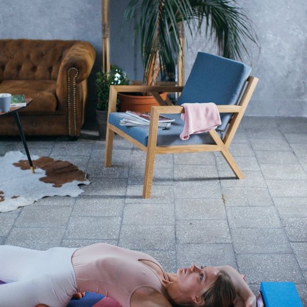 Cozy and calm corner of a room with a yoga mat and plants.